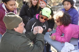 Ranger Craig Hensley explains the process of banding and release to children at GRSP.