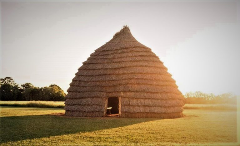 The grass house at the Caddo Mounds State Historic Site. The grass house was constructed using traditional materials and methods. Construction was led by a group of Caddo Nation elders and apprentices. Photo provided by the Texas Historical Commission