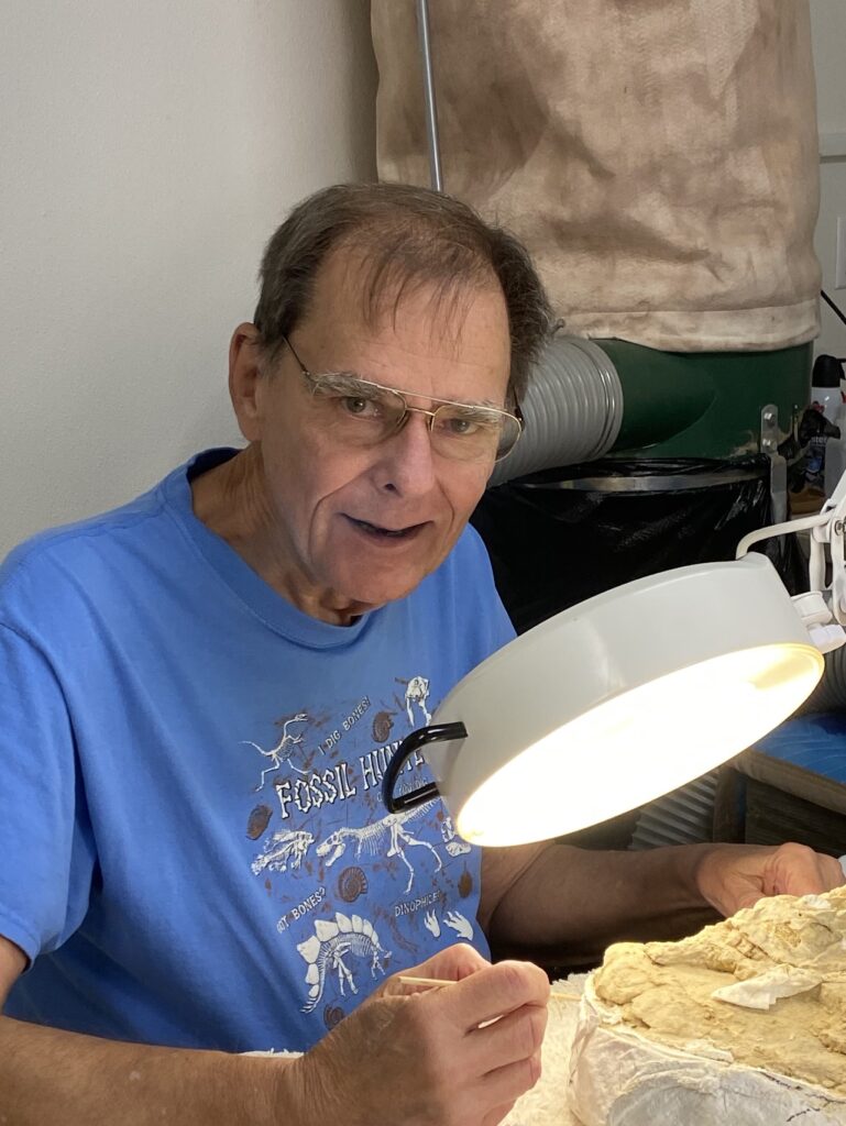 Jim Dulian cleaning a fossil