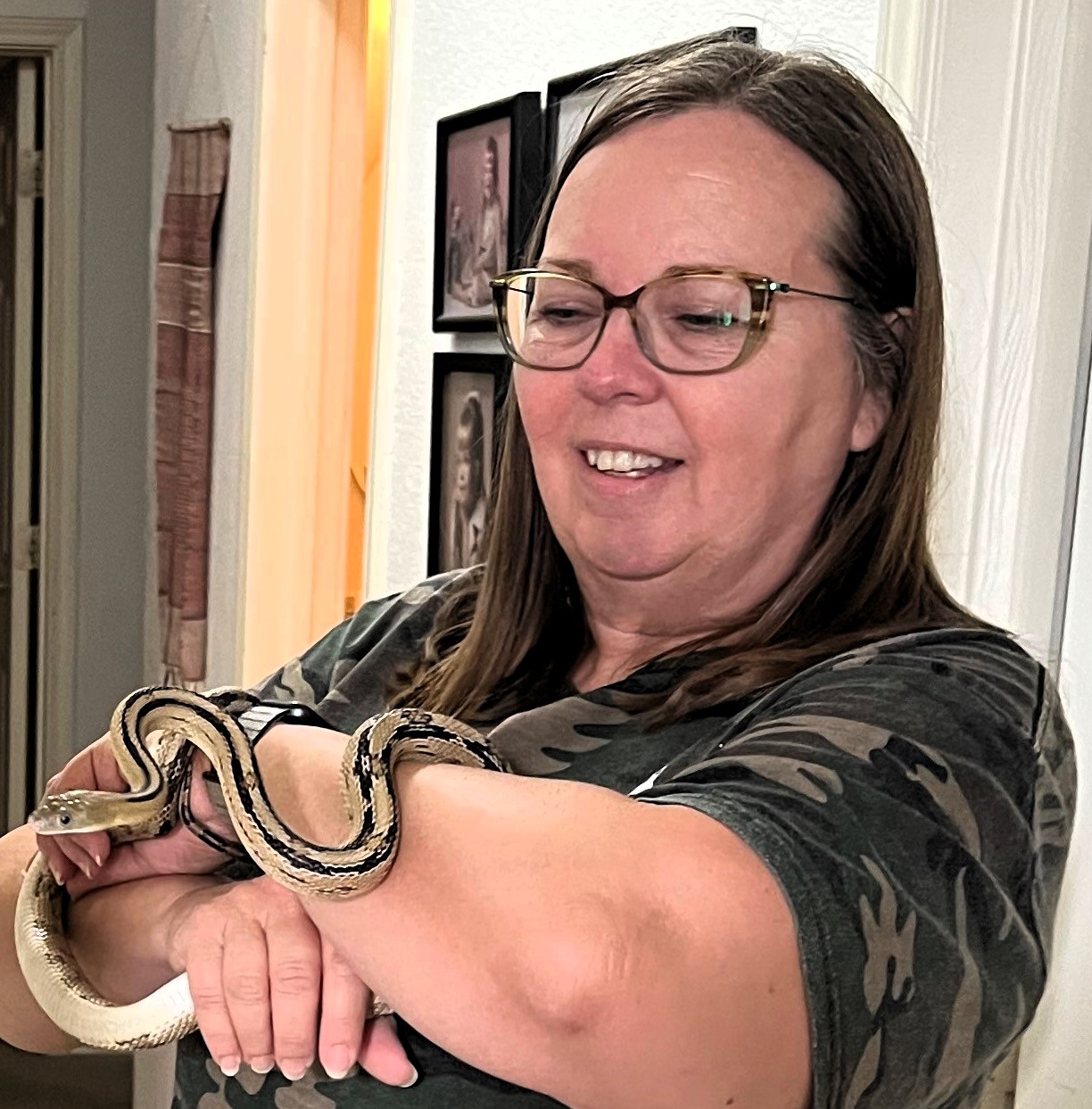 Donna Cole with her pet Trans-Pecos rat snake "Cinco de Milo"