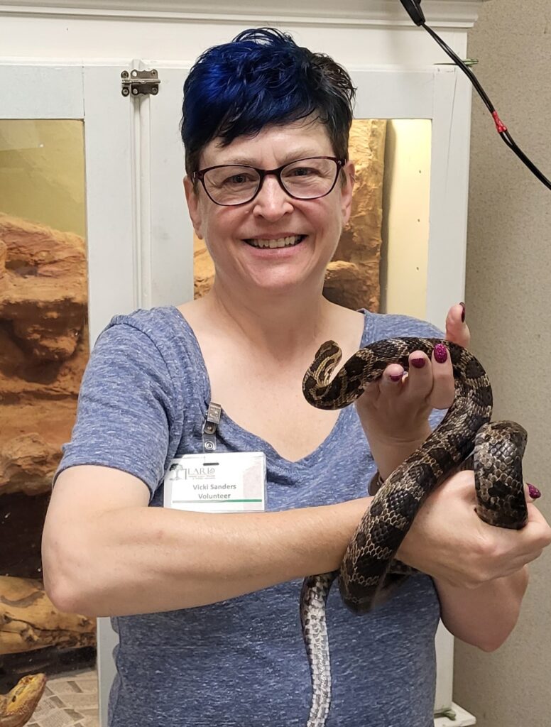 Vicki Sanders holding Emory the Heard Museum Rat Snake