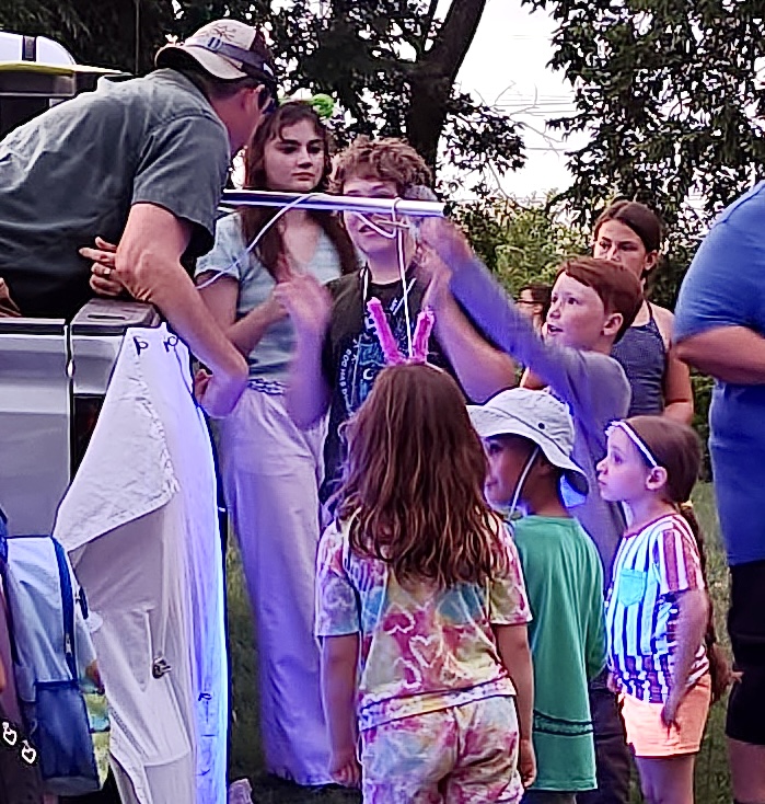 Sam teaching children about mothing