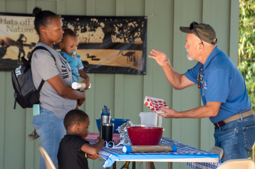 Woman with little boy and baby listening to Texas Master Naturalist.
