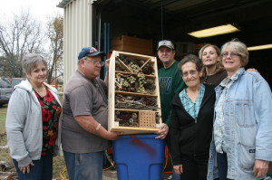 Indian Trail Master Naturalist members and one of the insect hotels they built.