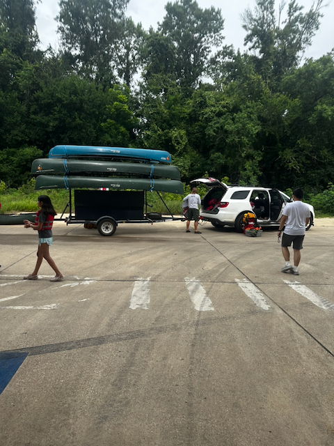 Canoes loaded on a trailer before the paddle program.