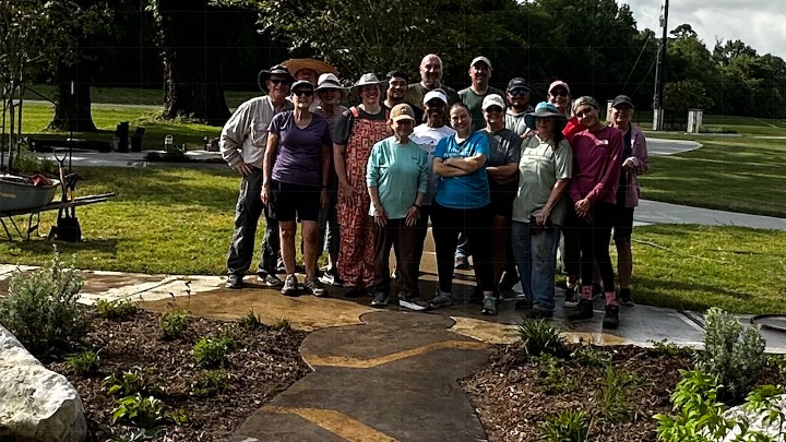 Planting Day volunteers gathered at the completed native gardens