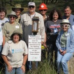 Work crew with new sign at the Trail Head