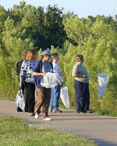 Members walk the trail at Lake Wichita looking for fall monarchs