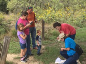 Family watches members tag a Monarch